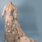 TRAINED IVORY SATIN WEDDING GOWN, 1880s