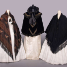 THREE SILK, VELVET OR EMBROIDERED WOOL CAPES, 1860-1870 &amp; c. 1893