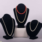 FOUR PEARL OR CARNELIAN STRANDS WITH PLATINUM OR GOLD CLASPS
