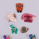 SIX LEA STEIN BROOCHES &amp; TWO UNSIGNED HAIR COMBS, PARIS