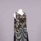 GEOMETRIC BEADED CREPE EVENING DRESS, C. 1925