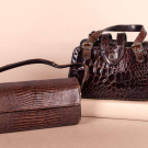 TWO CHIC BROWN REPTILE PURSES, MID 20TH C