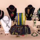GENEROUS LOT OF FLORAL AND FOLIATE BEADED COSTUME JEWELRY