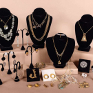 GENEROUS LOT OF GLAMOUROUS GOLD TONE COSTUME JEWELRY