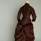 BROWN-BLACK BUSTLE GOWN, c. 1875
