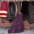 SIX SILK BUSTLE SKIRTS, 1870-1890