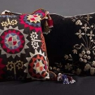 TWO EMBROIDERED SUZANI PILLOWS, 19th C.