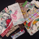 TWO DOZEN PRINTED SCARVES, 1940-1950s