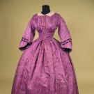 PURPLE BROCADE AFTERNOON GOWN, EARLY 1860s