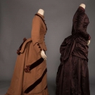 TWO BROWN BUSTLE DRESSES, 1880s