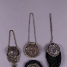 FOUR POUCH PURSES W/ EMBOSSED MEDALLION LIDS, c. 1900