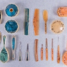 TWO LUCITE OR BAKELITE DRESSING SETS, 1930s