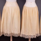 FOUR DECORATIVE WINTER PETTICOATS, 1870s