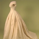 TRAINED CREAM SILK BALL-GOWN, 1860s