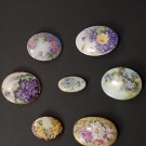 7 PAINTED PORCELAIN PINS, EARLY 20th C