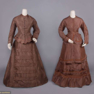 TWO BROWN SILK DAY DRESSES, LATE 1870s